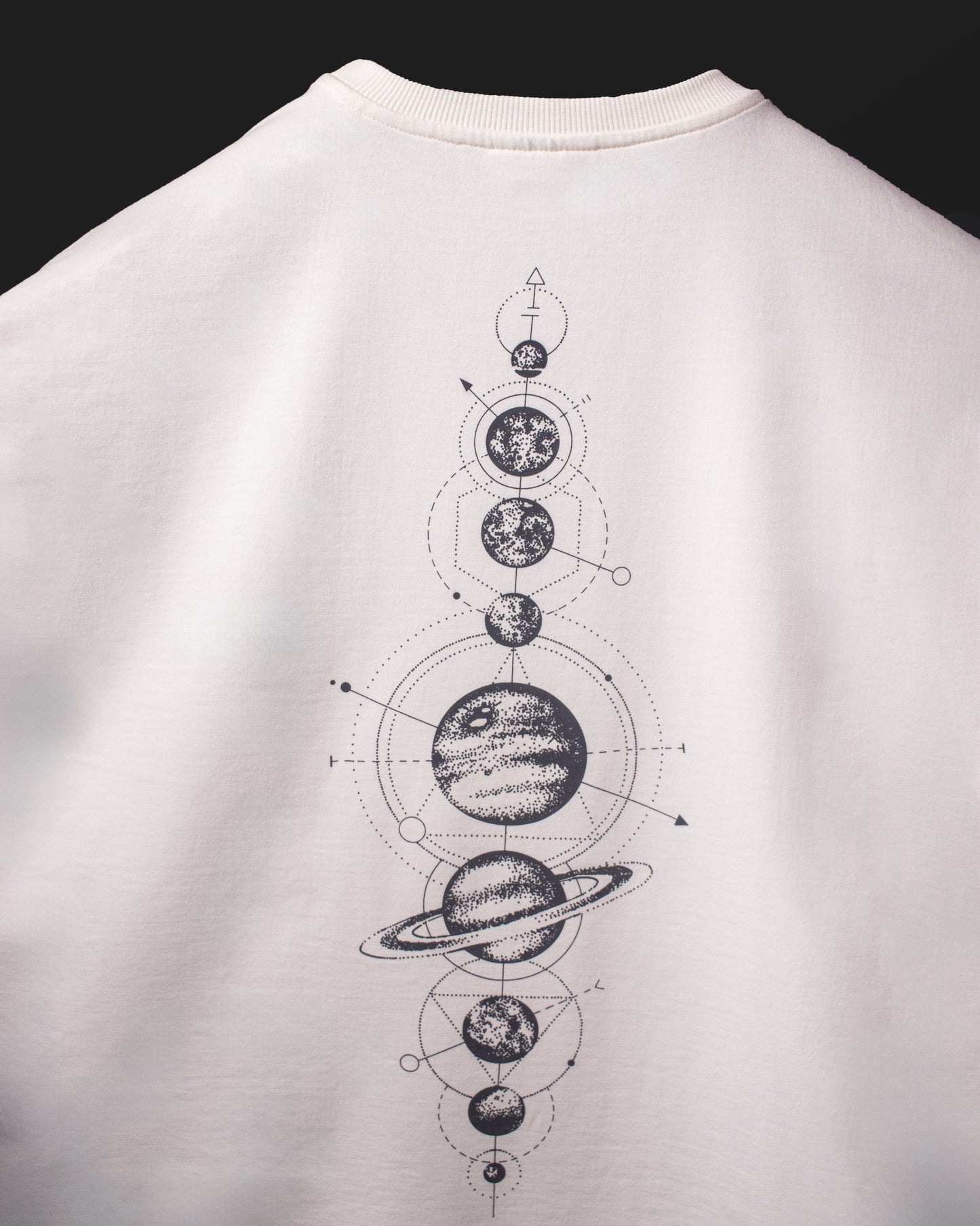 Full back view of the DVYNDRIP Creator T-shirt featuring a vertical cosmic planet diagram graphic