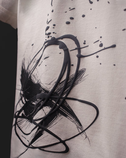 Close-up of raised ink and abstract brush print texture on the DVYNDRIP Creator T-shirt