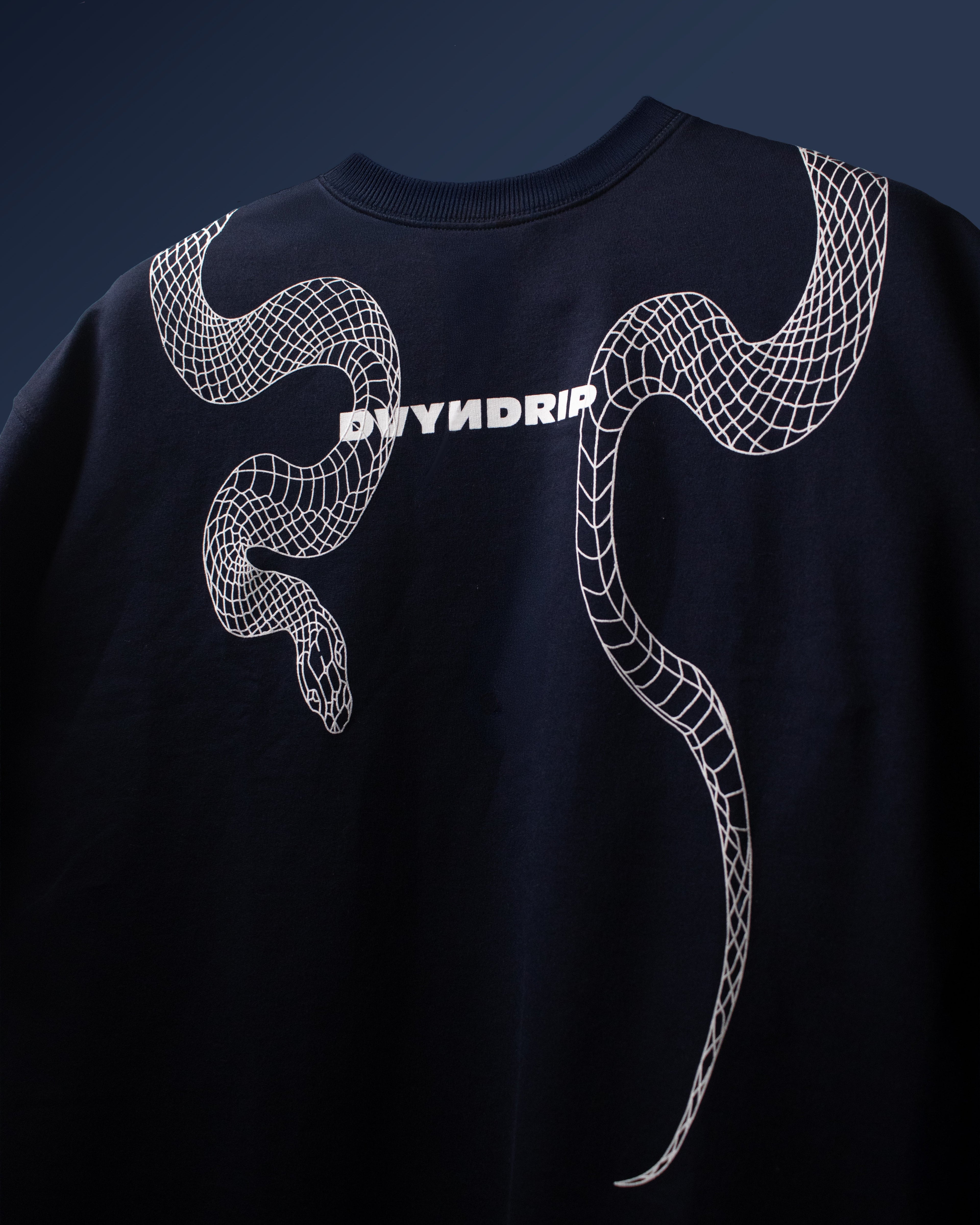 Front view of DVYNDRIP The Destroyer oversized t-shirt featuring a puffed white serpent graphic across the chest and logo print.